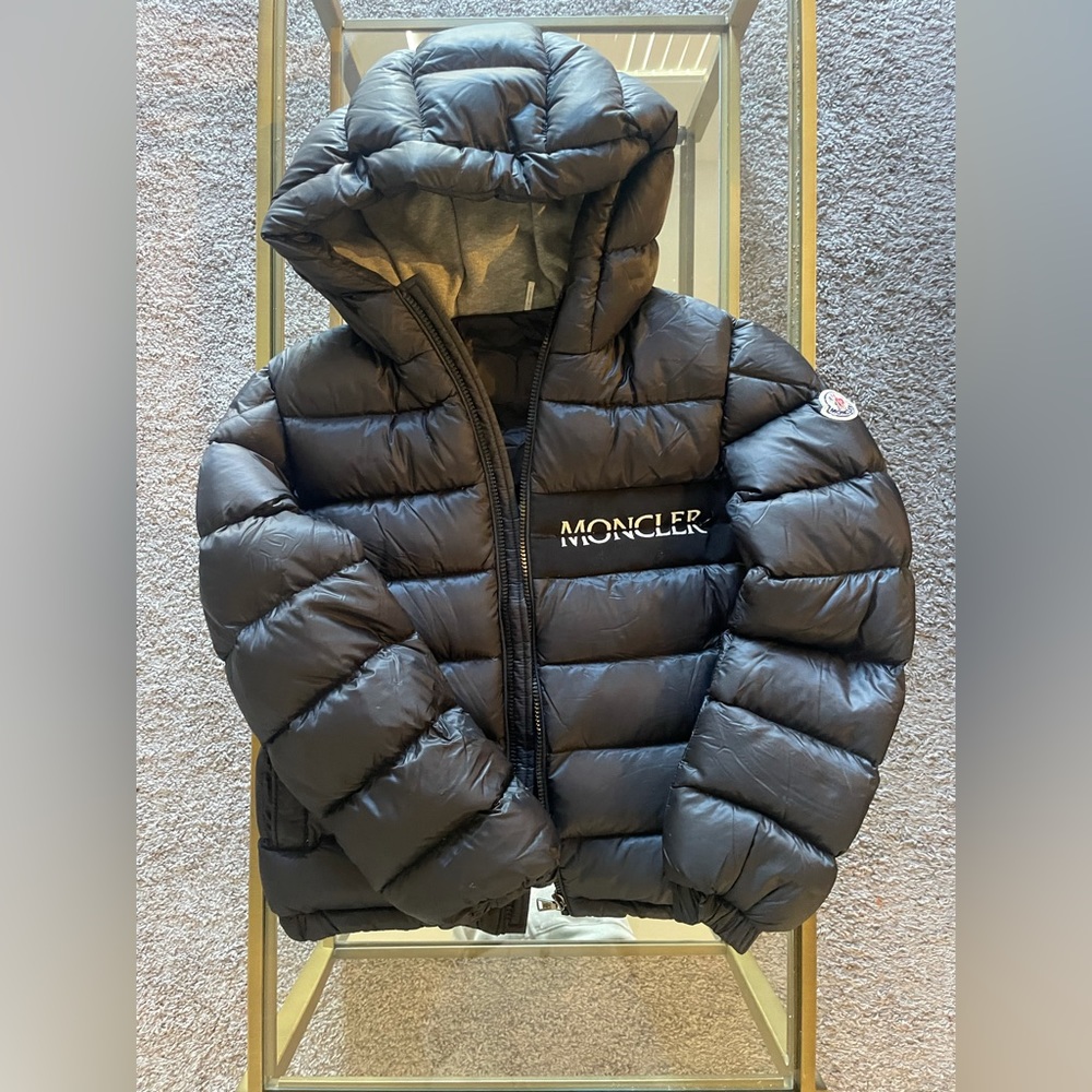 Kids monclear jacket has a small cut on the arm